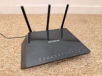 Top view of Netgear router with three antennas extended