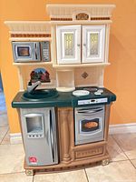 Full front view of Step2 play kitchen showing all appliances and features