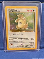 Front view of Kangaskhan holographic card in sleeve