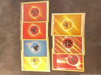 Eight sleeved holo Energy cards laid out in two columns