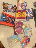 Overview of ten mini portfolio binders spread on table