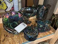 All seven pieces grouped on shelf