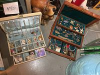 overall view of both open jewelry boxes with contents visible