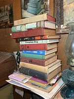 Full stack of vintage books on table