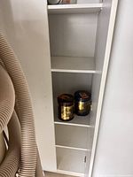 Full view of interior shelves with items for scale