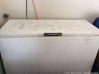 Front view of the white Viking chest freezer showing the rectangular top, surface stains, and marks.