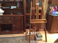 Wooden art easel on tripod base