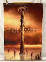Front color side of poster showing Promised Land artwork
