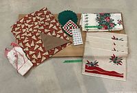 All items grouped on board showing tablecloth, placemats, potholders, towel