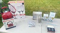 Overview showing kettle, boxed glass sets, shaker and accessories