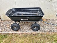 Side view of Gorilla Carts wagon showing tub, wheels and handle