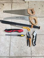 Group shot of all eight tools laid out on floor