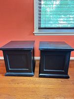Front view of both black end tables showing overall design and size