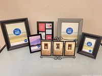 Group shot of six photo frames displaying various sizes and finishes