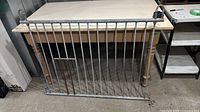 Full view of galvanized steel gate panel leaning against table