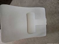 Front view of white memory foam backrest pillow with attached lumbar bolster