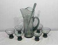 Full set showing pitcher, stirrer, six glasses