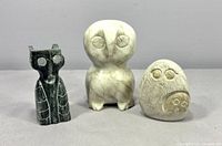 Group shot of three soapstone owl figurines