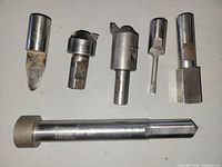 Overall view of six steel cutting tools laid out