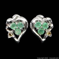 Front view showing emerald cluster and yellow sapphire in heart setting