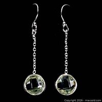 Full view of both chain-drop earrings showing gemstones and hooks