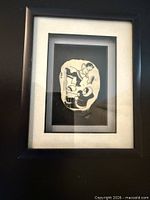 Full view of framed soapstone disk within mat and frame