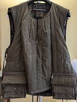 Front view showing quilt pattern, pockets, zipper, brand label