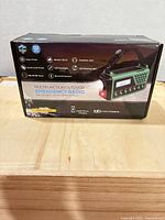 Front of product box showing radio features and image of unit