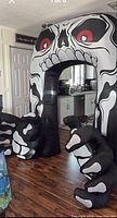 Fully inflated skeleton archway standing indoors