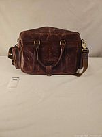 Back view highlighting rear panel, shoulder strap anchors and side pocket