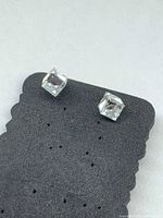 Front view of both earrings showing cube-cut stones on display card