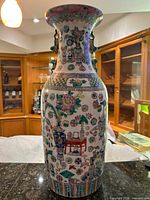 Full view of vase front showing decoration and rim