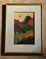 Full view of framed Susan Minier textile collage with gold frame and white mat