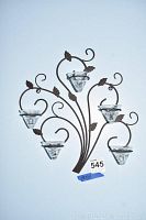 Metal leaf wall decor with glass holders showing full design and shape