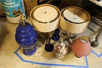 Full lot of six table lamps and lampshades, showing variety of items included.