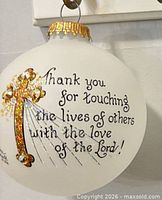 Front of ornament showing cross, crystals and thank-you inscription