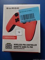 Front of sealed Surge Wireless Pro Controller box showing red controller image