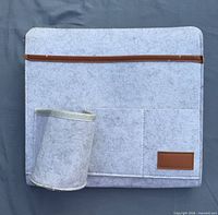 Front view showing felt organizer, horizontal pocket with brown trim, cup sleeve and patch