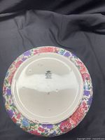 Underside of the Crown Ducal bowl showing maker’s mark and exterior floral pattern