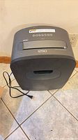 Front view of Royal 1250X shredder showing slot, logo and power cord