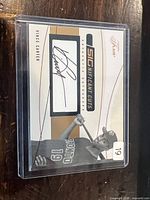 Front of 2004 Fleer Flair Significant Cuts Vince Carter autograph card showing signature window and player image