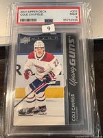Front of PSA-slabbed Cole Caufield Young Guns card showing grade label