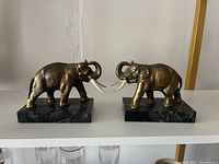 Front view of both elephant bookends