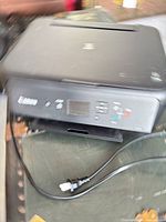 Front and top of Canon TS5120 printer with power cord
