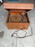 Top view showing turntable platter area, tonearm, cabinet interior