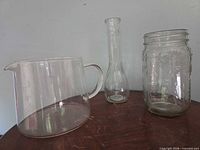 Group shot of pitcher, vase, mason jar