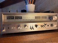 Front view of Pioneer SX-90 receiver showing controls and meters