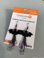 Front of retail card showing bat earrings and decorative dangles