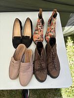 Group shot of all four shoe pairs on table