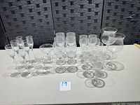 Group view of all 25 etched crystal stemware pieces